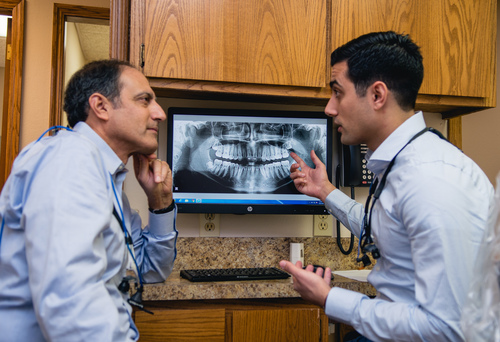 Shadid dentists discussing patient xrays